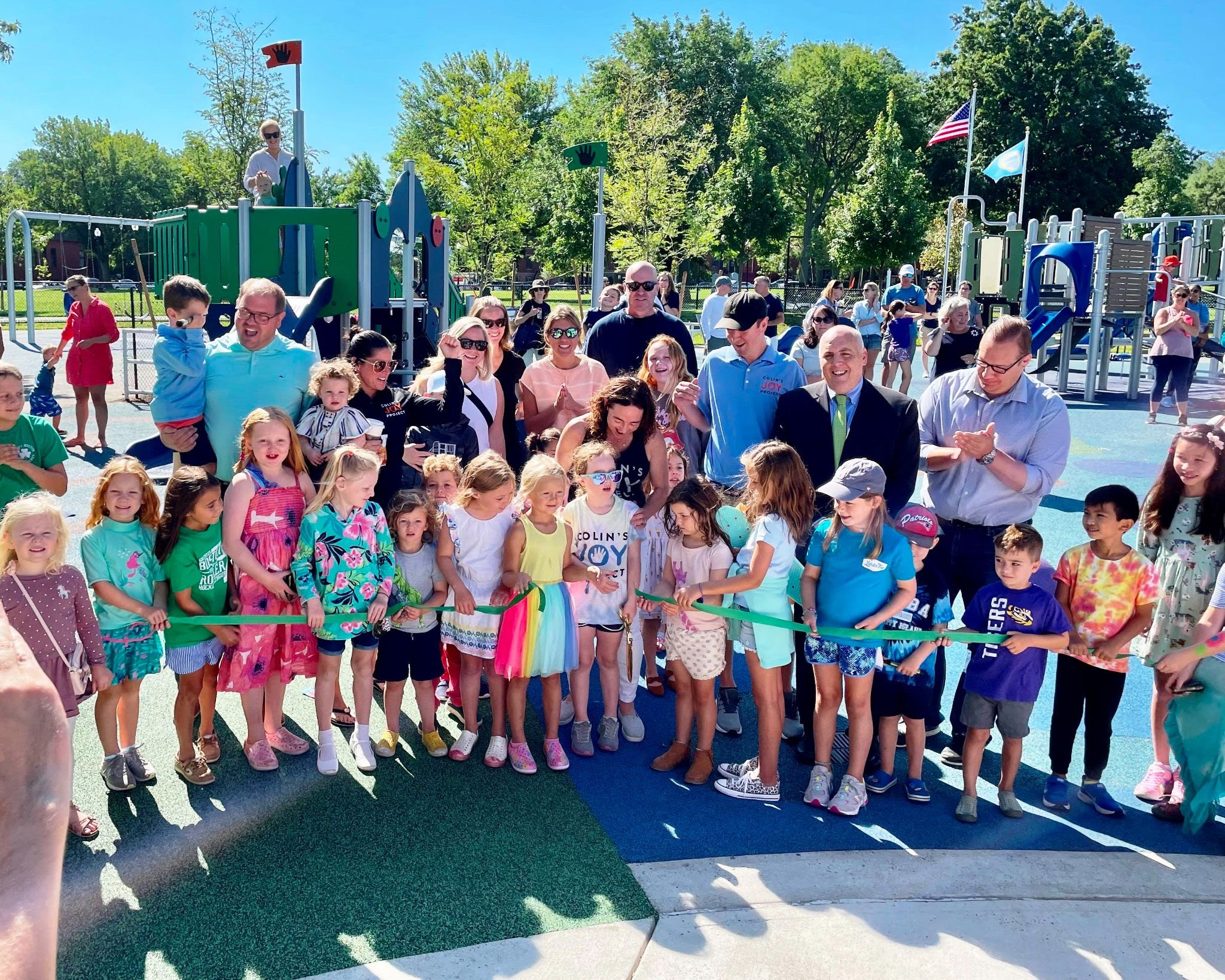 A crowd celebrates at the September 4 opening of a new play area in South Boston’s Medal of Park