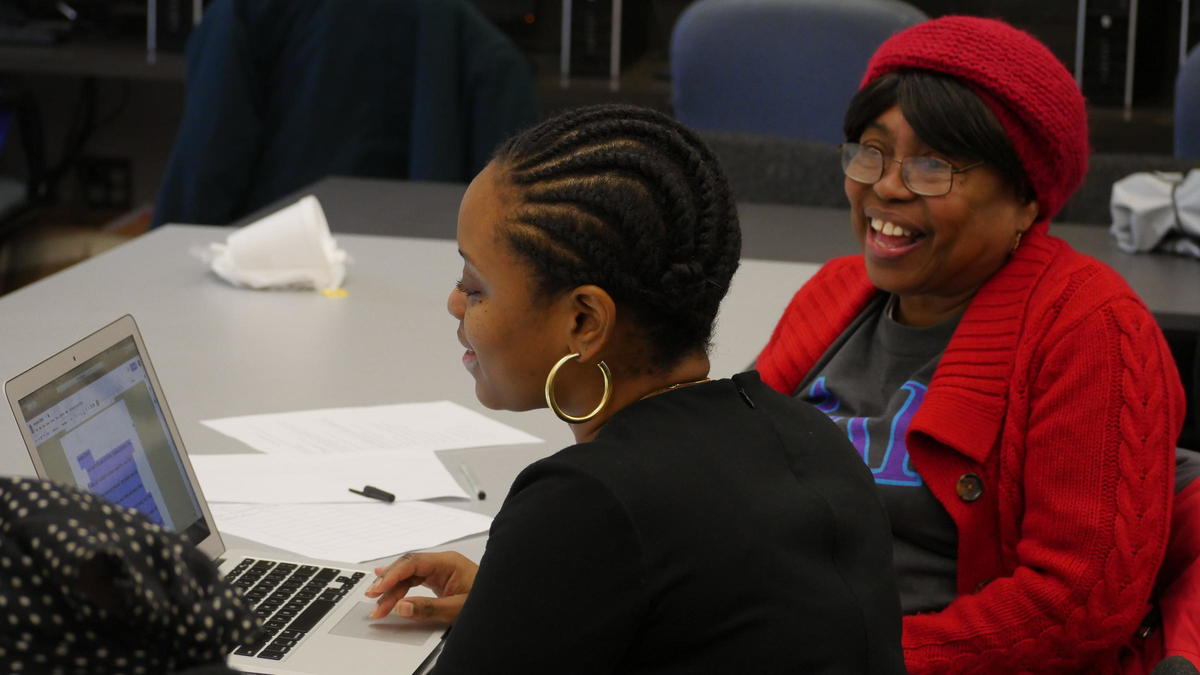 Boston artist-in-residence Nakia Hill leading writing workshop at Grove Hall senior center