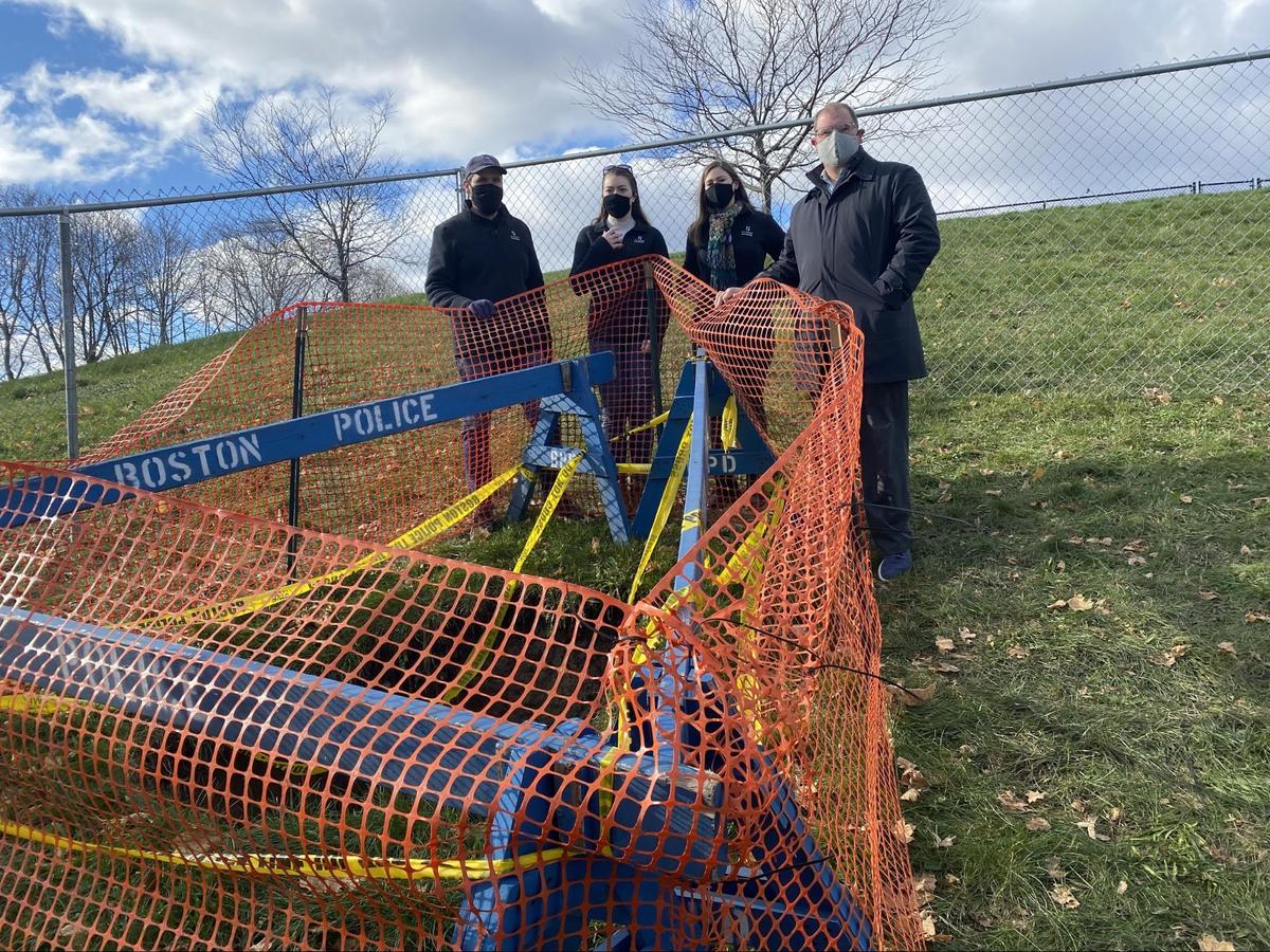 Standing behind the hole are from left: City Archaeologist Joe Bagley, Project Archaeologist Lauryn Poe, Digital Archaeologist Nadia Kline, and Parks and Recreation Commissioner Ryan Woods.