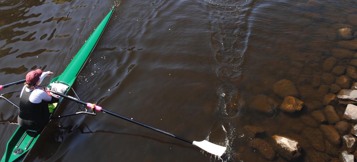 A person rowing in the City of Boston