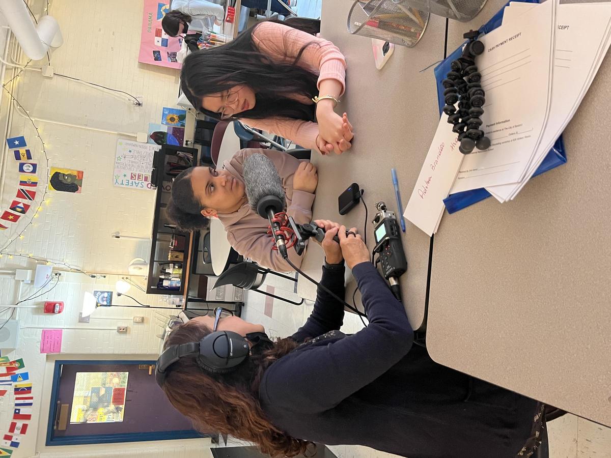 Heloiza recording audio stories with students at BINCA.