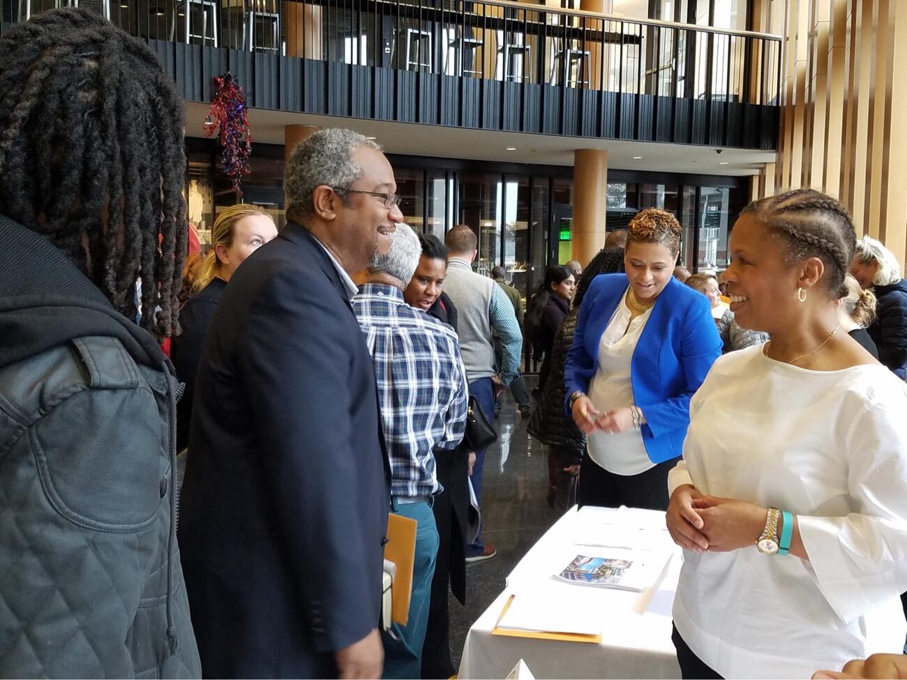 Picture of two people chatting at outreach event